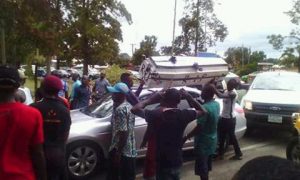 The supporters with the casket at the airport